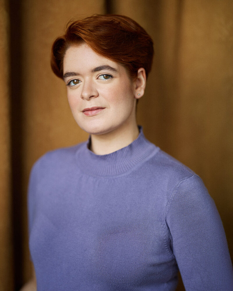 Montreal-actress-headshot-vintage-look-red-short-hair-blue-turtleneck-sweater-by-nadia-zheng