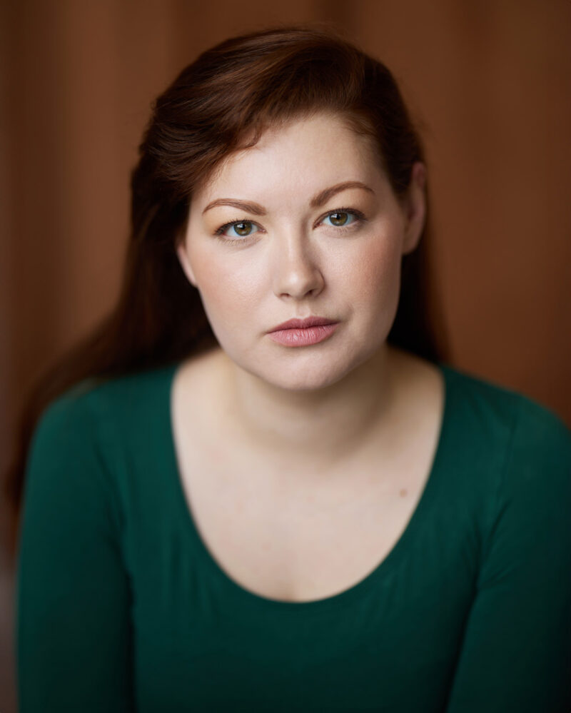 Montreal-actress-singer-headshot-green-shirt-orange-curtain-background-by-nadia-zheng.jpg