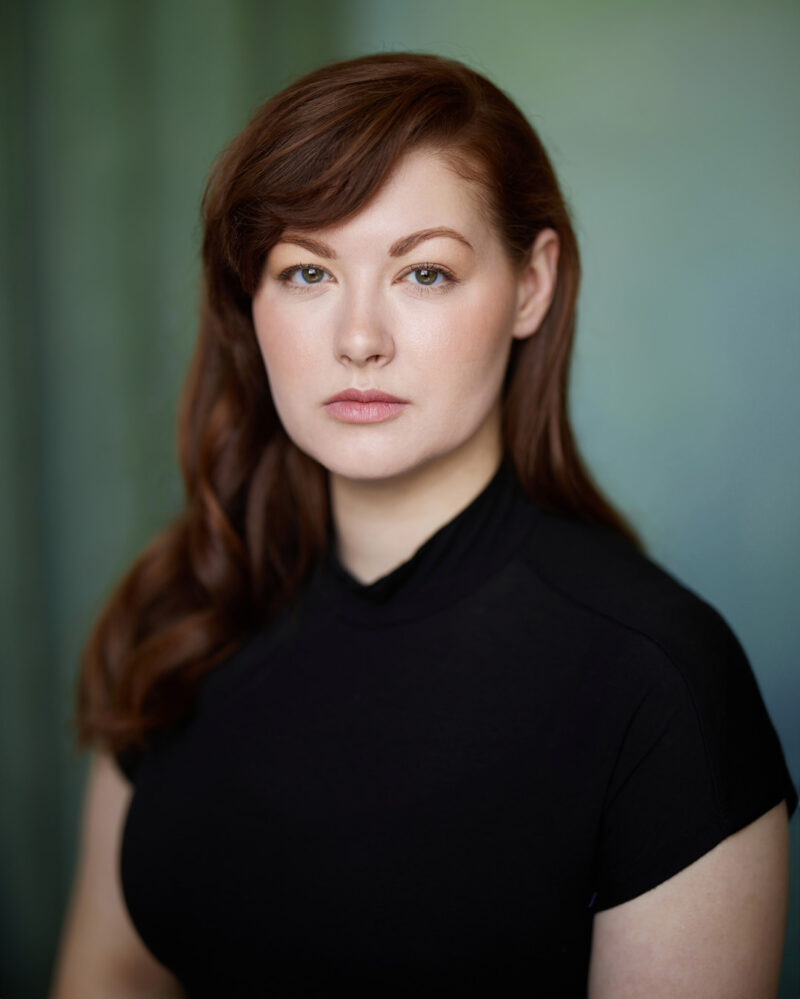 Montreal-actress-singer-headshot-turtle-neck-turquois-canvas-background-by-nadia-zheng.jpg