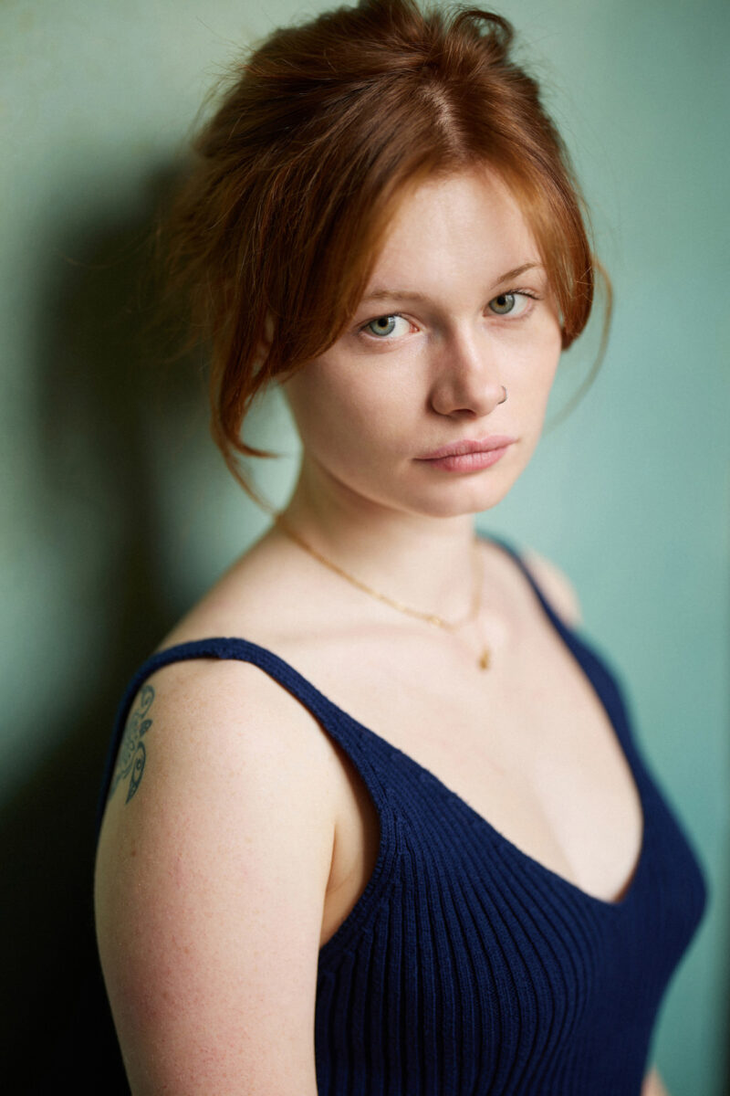 Montreal-casting-headshot-blue-camisole-red-hair-canvas-background-by-nadia-zheng