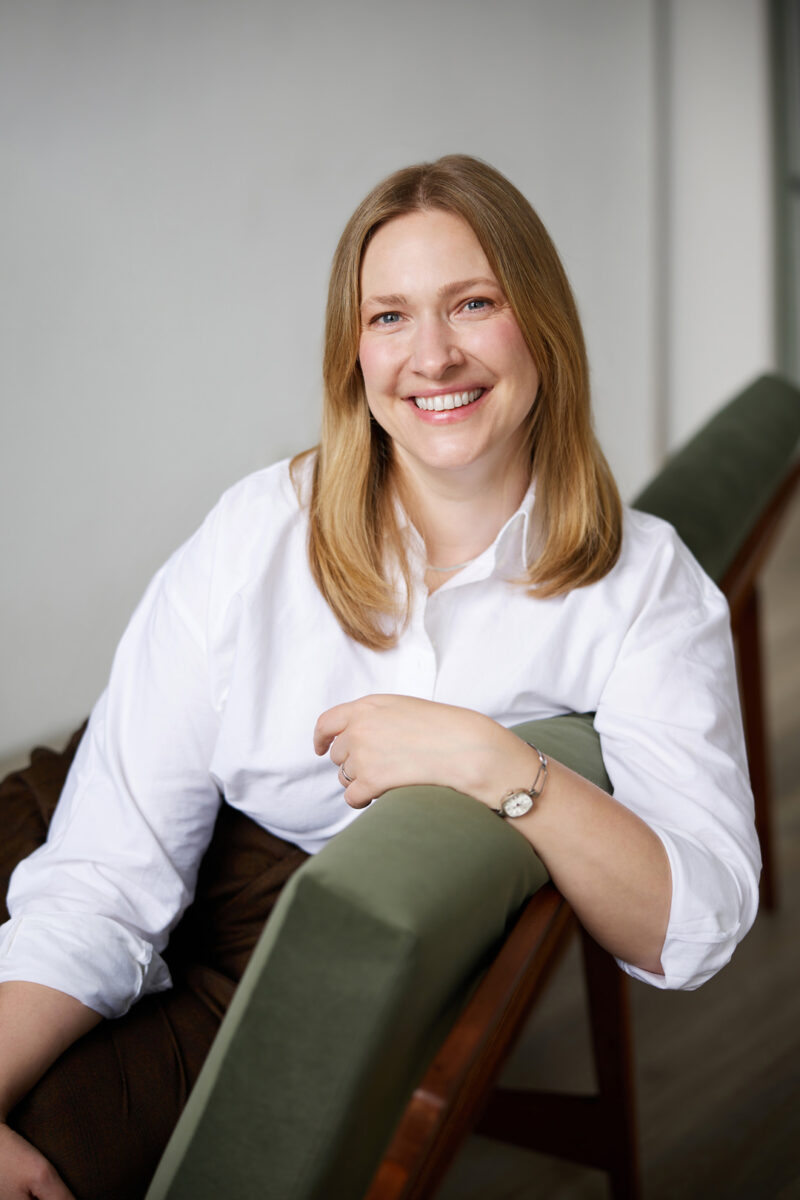 Montreal-lifestyle-personal-branding-portrait-casual-white-shirt-long-hair-green-velvet-sofa-by-nadia-zheng